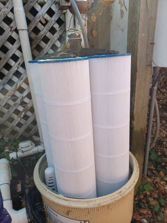 Pool filter cartridges cleaned and replaced as part of routine pool service
