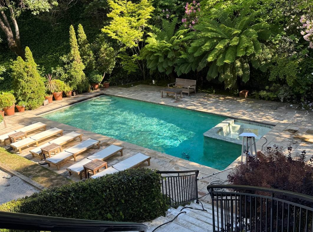 San Rafael pool and spa service featuring clean residential swimming pool and surrounding landscape